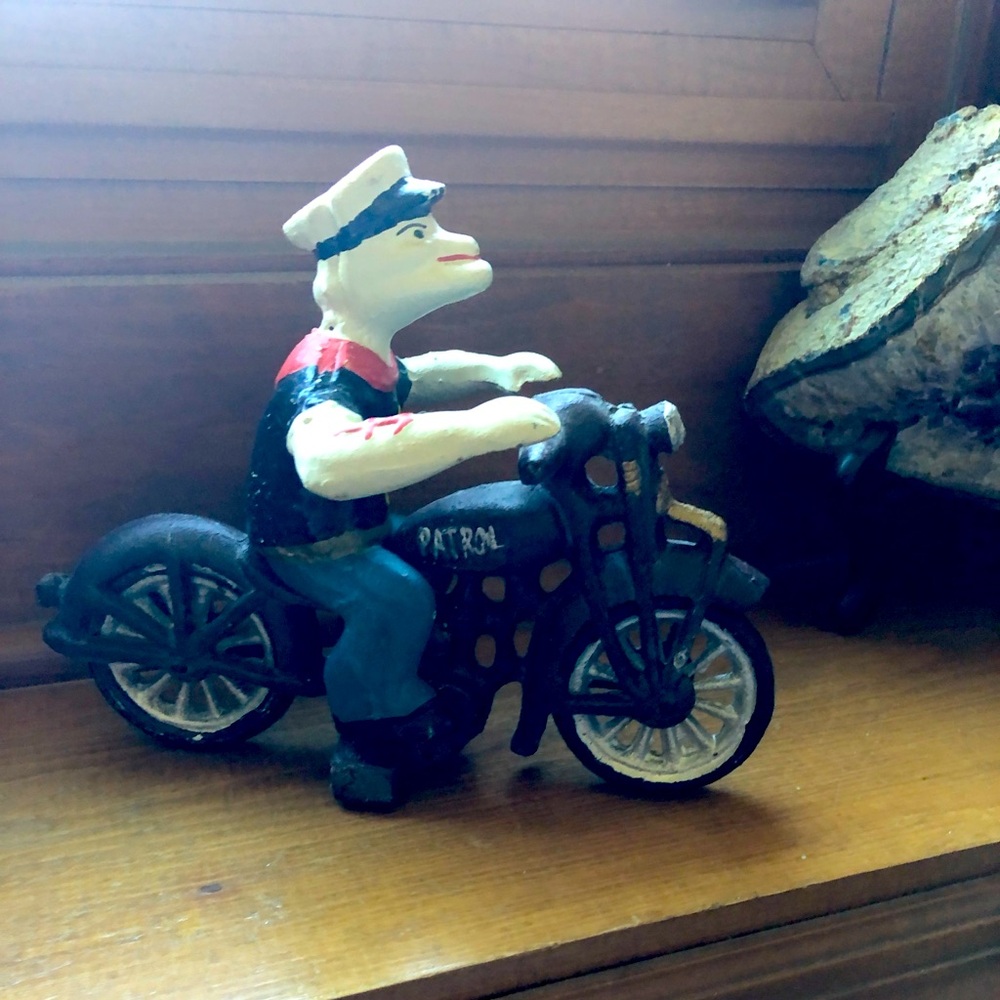 Vintage cast iron figurines of Popeye the Sailor Man.